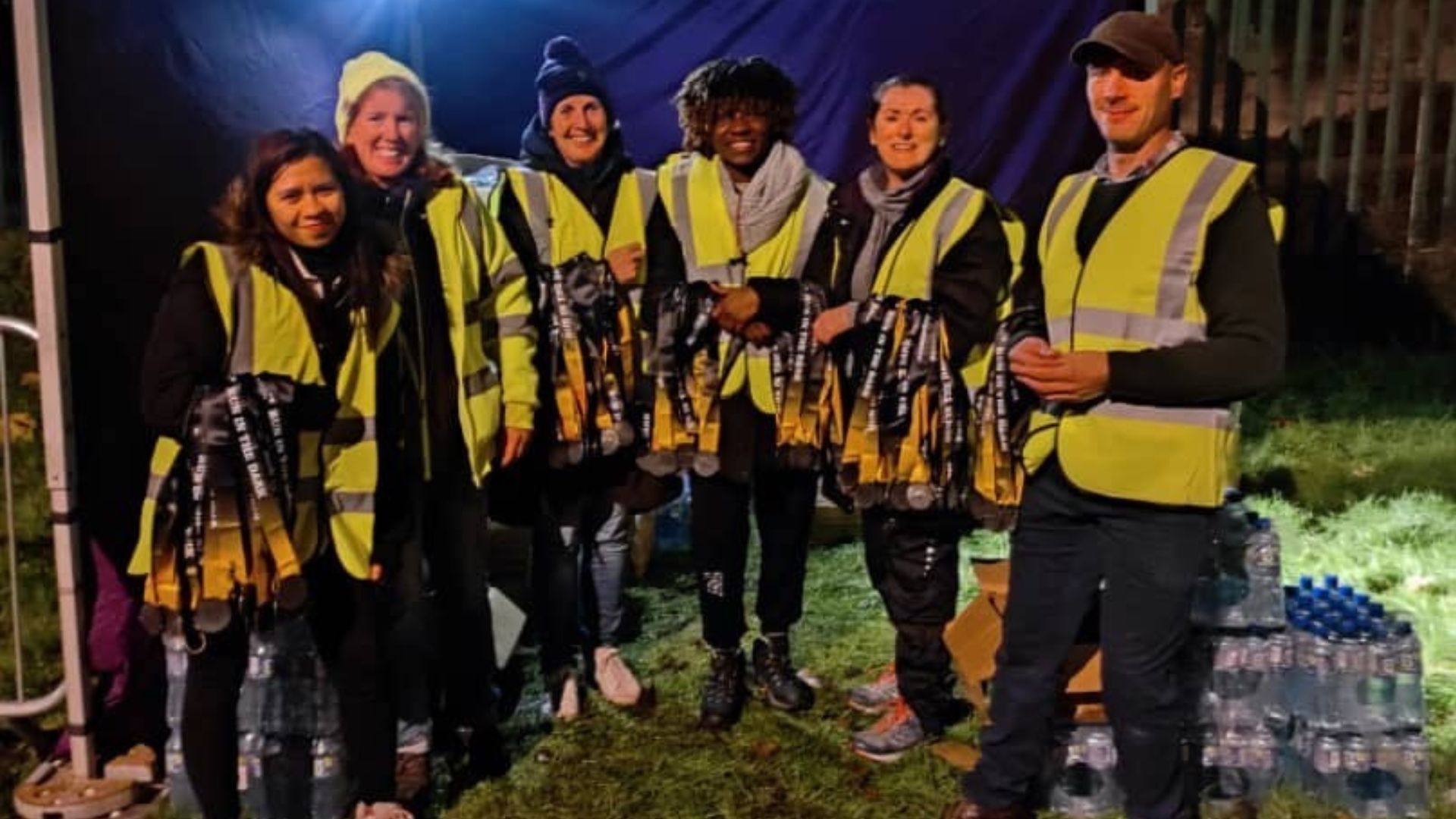 Run in the Dark volunteers with beverages on table